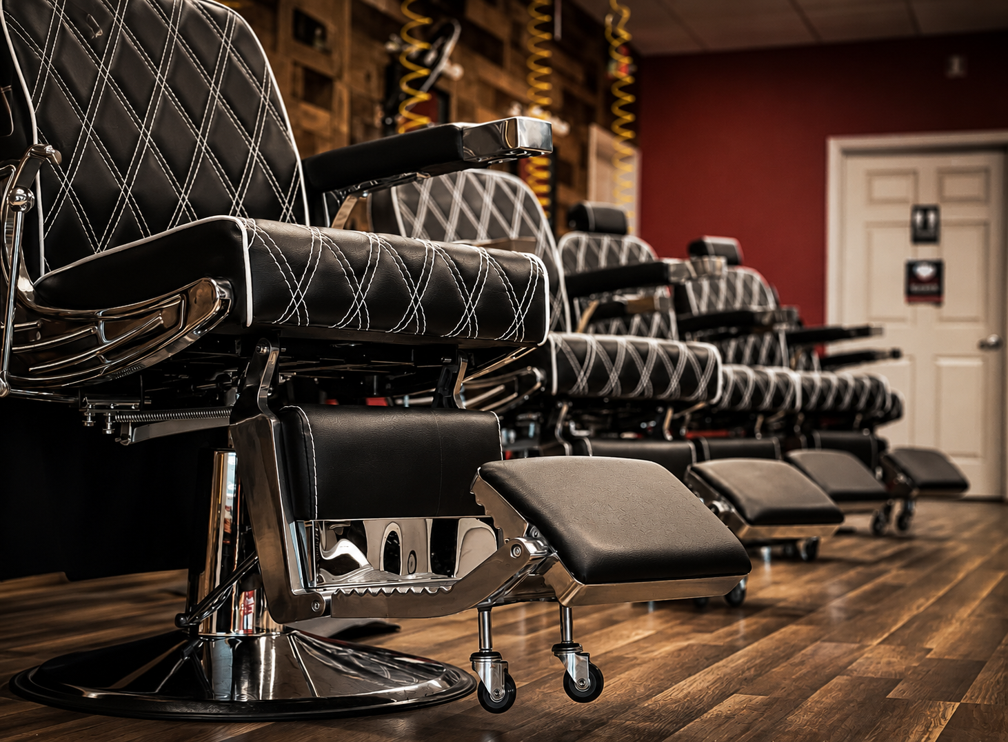 Black barber chairs inside Nu Image Barber Shop